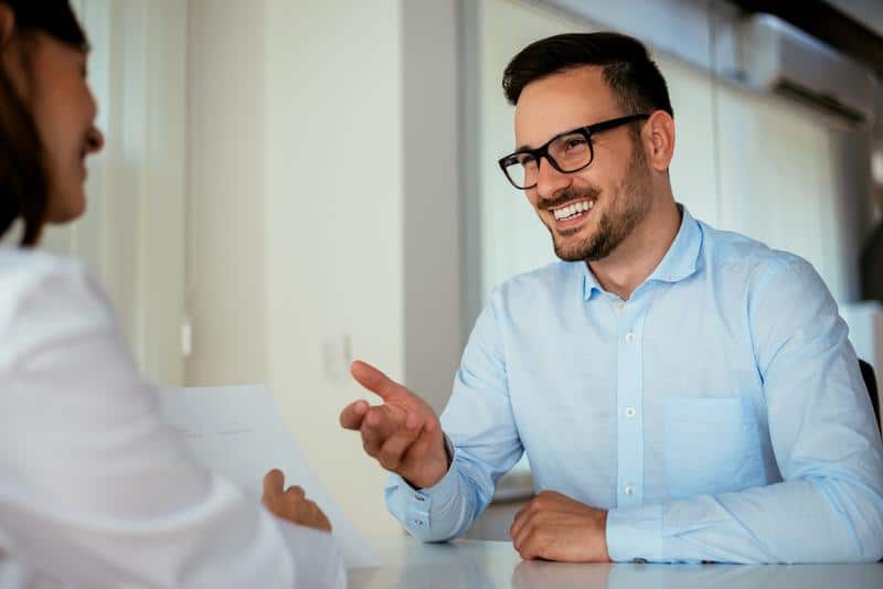 man-speaking-with-doctor-in-ent-office man speaking with doctor in officer