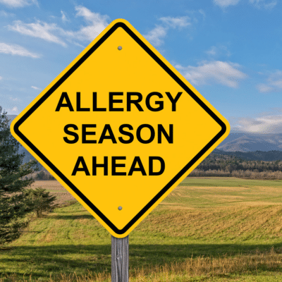 Yellow sign that reads: Allergy Season Ahead