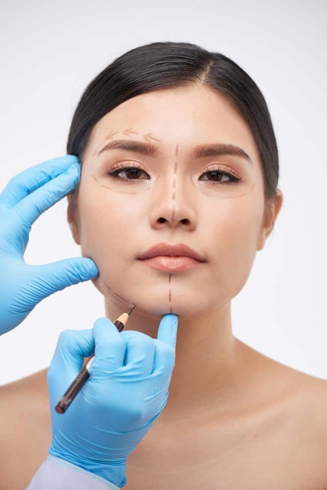 1760111262_Woman-plastic-surgery-preperation-writing-on-face