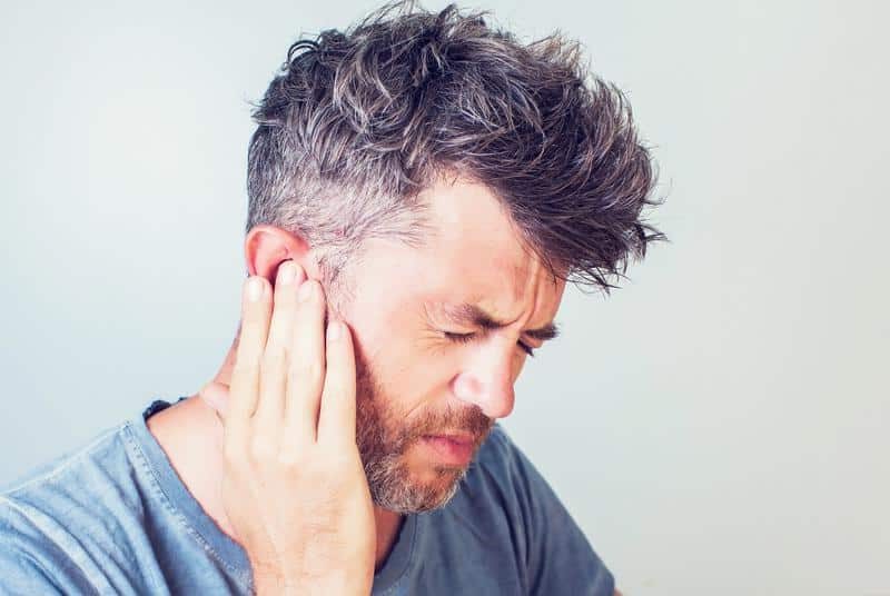 1760111442_man-holding-ear-pain-e1668717578643
